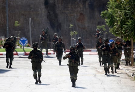 Critics in Israel say a lack of will on the part of soldiers in Qusra has led to the siege continuing.Photograph: Anadolu/Getty