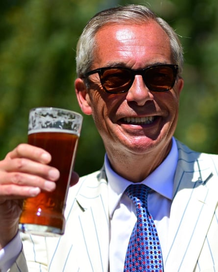 Nigel Farage poses with a pint in a Clacton pub beer garden.Photograph: Victoria Jones/Shutterstock