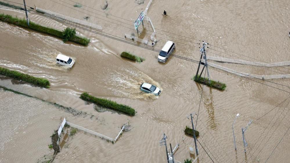 Image caption,Cars were left abandoned in the streets of Oamishirasato, in Chiba
