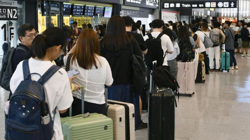 Image caption,Thousands were stranded overnight at Narita as the storm disrupted transportation to and from the airport
