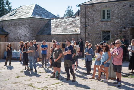Staff at Hamathey farm listen to Swiderski