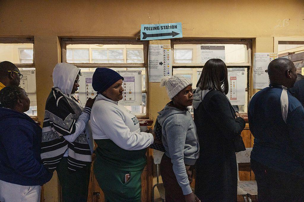 Image caption,Queues were seen at polling stations during a chilly Thursday morning in the capital, Lusaka