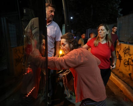 Local residents and tourists are evacuated from Siviri as a forest fire threatens the resort on Halkidiki peninsula, Greece.Photograph: Alexandros Avramidis/Reuters