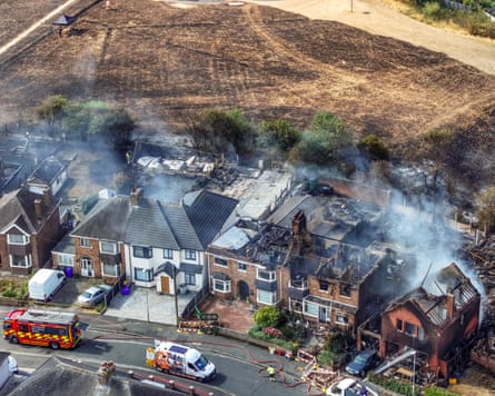 The remains of homes in Stoke-on-Trent smoulder on Friday as wildfire raced across the West MidlandsPhotograph: Christopher Furlong/Getty Images