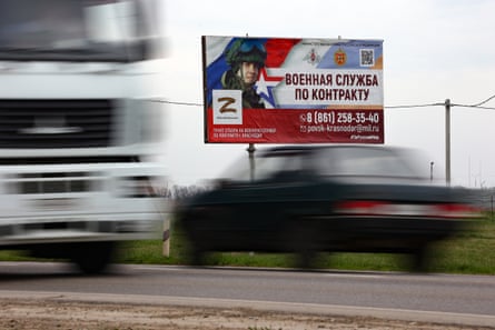 A billboard advertising ‘contract military service’ beside a highway outside Krasnodar, Russia.Photograph: AP