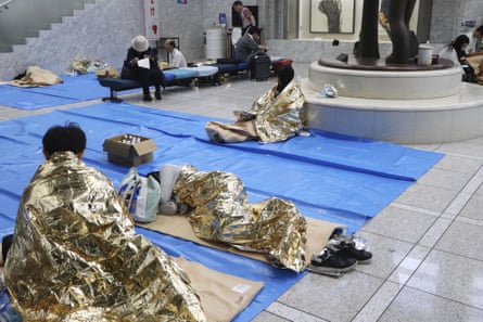A makeshift evacuation centre set up at the Chiba prefectural government building after transport was disrupted by the torrential rain.Photograph: Kyodo/Reuters