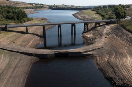 A historic packhorse bridge is exposed at Baitings reservoir, near Sowerby Bridge.Photograph: Jon Super/AP