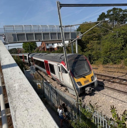 Emergency services arrive near the scene of the derailment on Friday.Photograph: Lucy North/PA