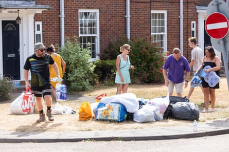 Volunteers and helpers handling donations to Old Swinford hospital boarding school in Stourbridge.Photograph: Fabio De Paola/The Guardian