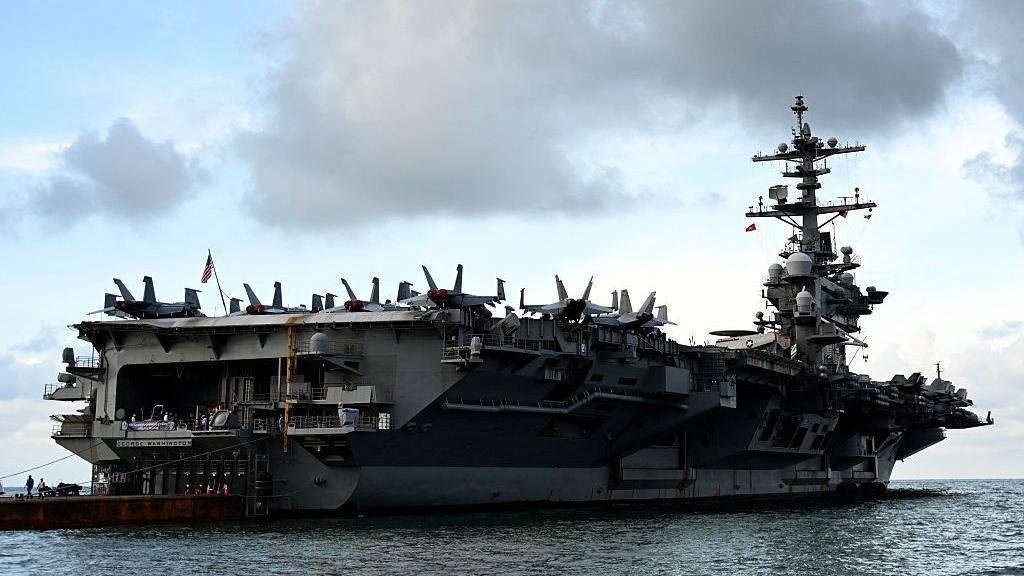 Image caption,The USS George Washington left on a Pacific patrol in May, but is now headed west to the Middle East.