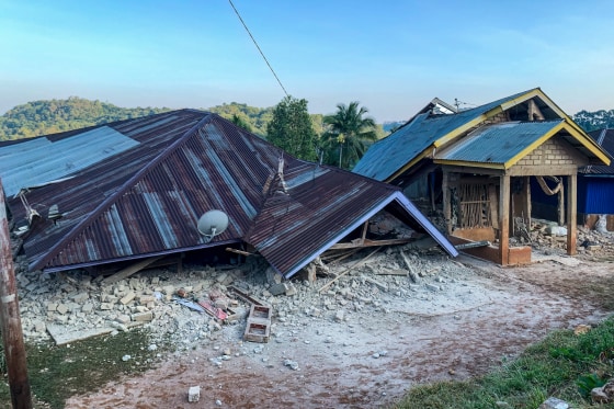 Villagers flee their homes to seek safety following a earthquake in Talibura Village, Sikka, East Nusa Tenggara, on Saturday.Arnold Welianto / AFP via Getty Images