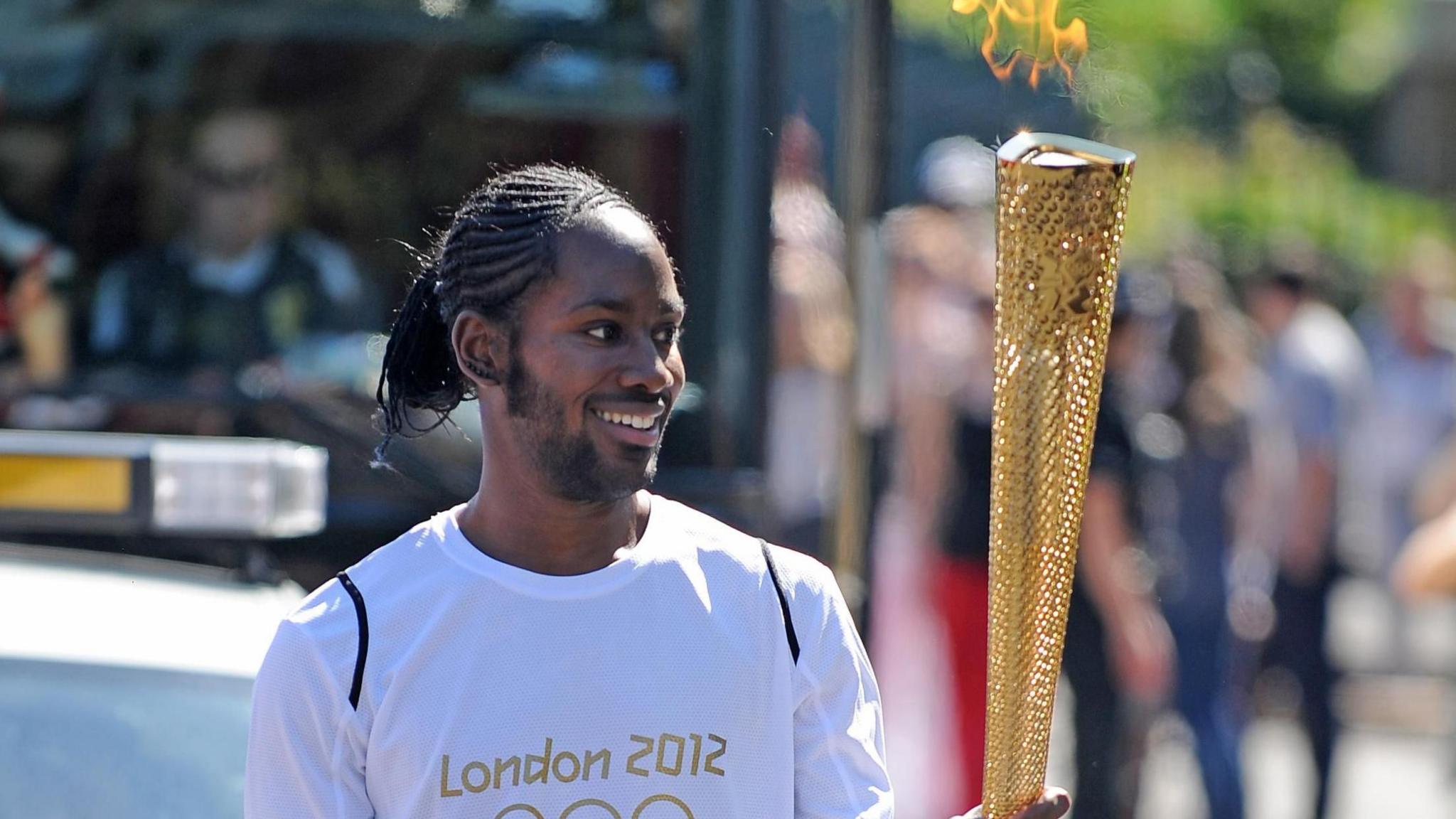 Image caption,Arday carried the Olympic Flame on the 2012 Torch Relay leg between Sutton and Merton in London