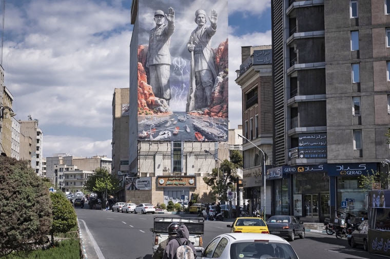 A dramatic billboard that appears to refer to "The Lord of the Rings" depicts guards blocking the Strait of Hormuz.Morteza Nikoubazl / NurPhoto via Getty Images
