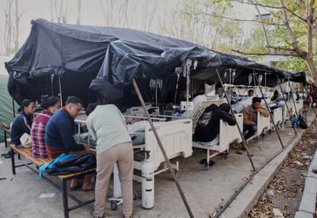 Patients receive treatment inside a makeshift tent outside a hospital in Labuan Bajo, East Nusa Tenggara province.Photograph: Firdia Lisnawati/AP