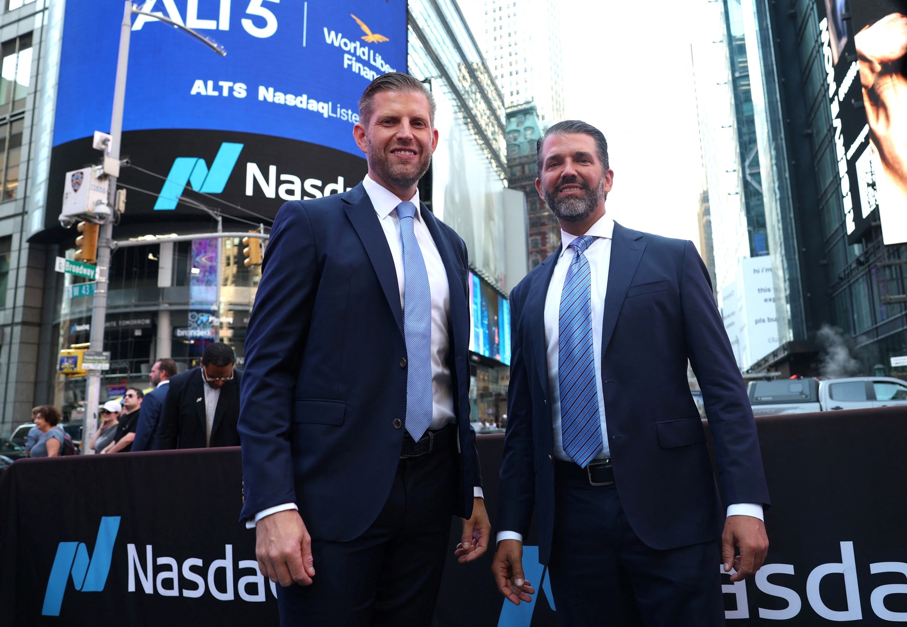 Eric Trump, newly appointed ALT5 Board Director, and ALT5 Board Observer Donald Trump Jr. pose outside Nasdaq in Times Square in New York on August 13, 2025 as World Liberty Financial and ALT5 Sigma ring the Nasdaq Stock Market opening Bell.Timothy A. Clary/AFP via Getty Images