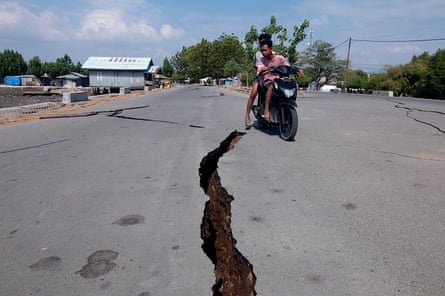 A crack in the road in East Nusa Tenggara after the quake.Photograph: Ignasius Kunda/EPA