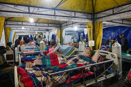 Earthquake victims are treated in a temporary medical tent amid fears of aftershocks in Ruteng.Photograph: Juni Kriswanto/AFP/Getty Images