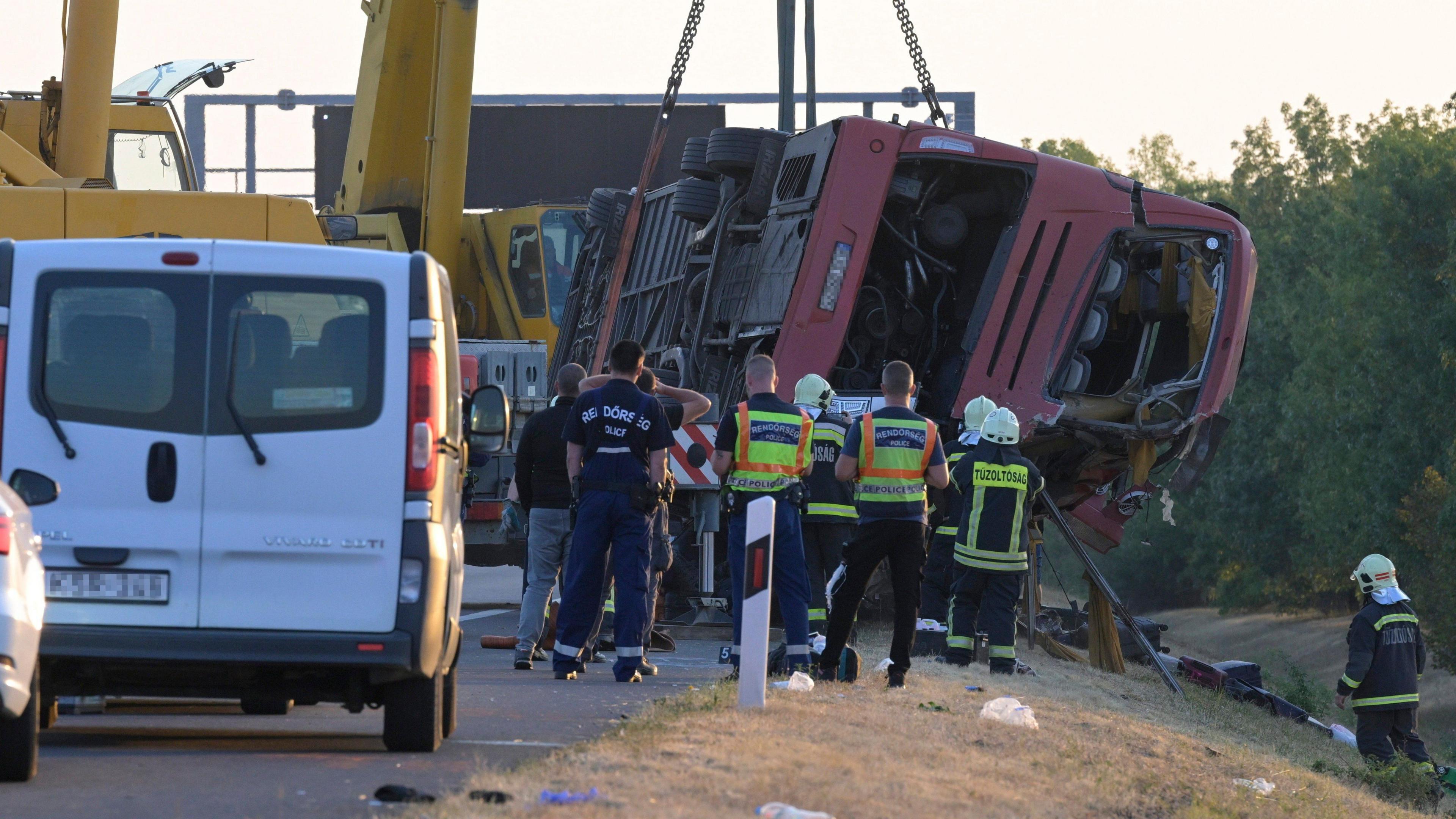 Image caption,The bus came off the motorway and overturned into a ditch running beside the road
