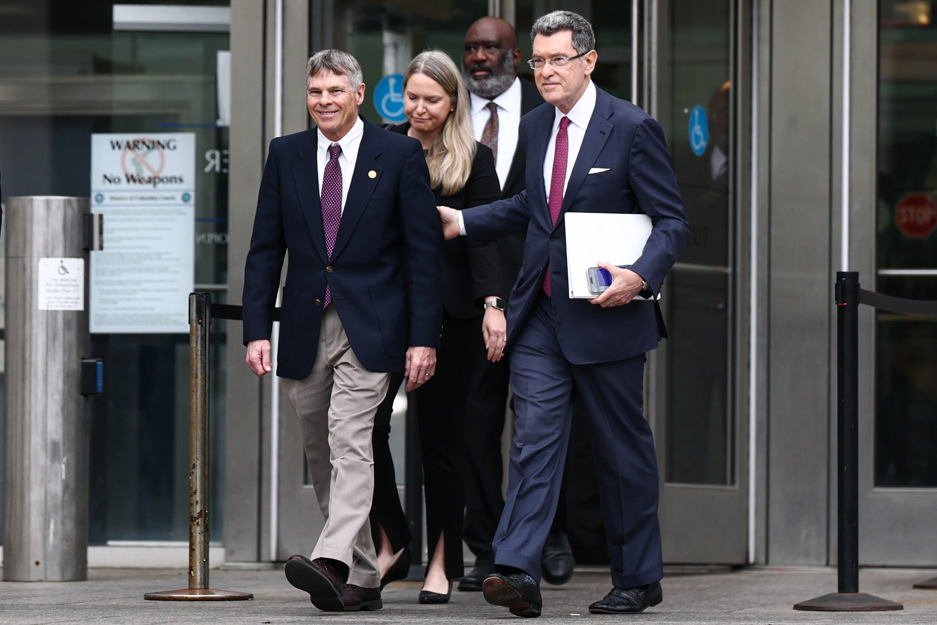 Former Olympian David Hearn walks with his attorney Norman Eisen to speak to reporters and protestors gathered after his arraignment at Moultrie Courthouse, July 9, 2026, in Washington, D.C.Finn Gomez/Getty Images
