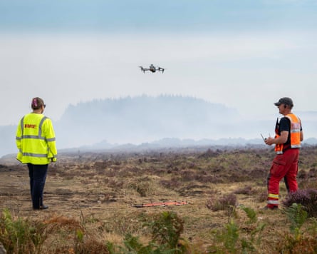 Darren Cleaves operating the drone.Photograph: Adrian Sherratt/The Guardian