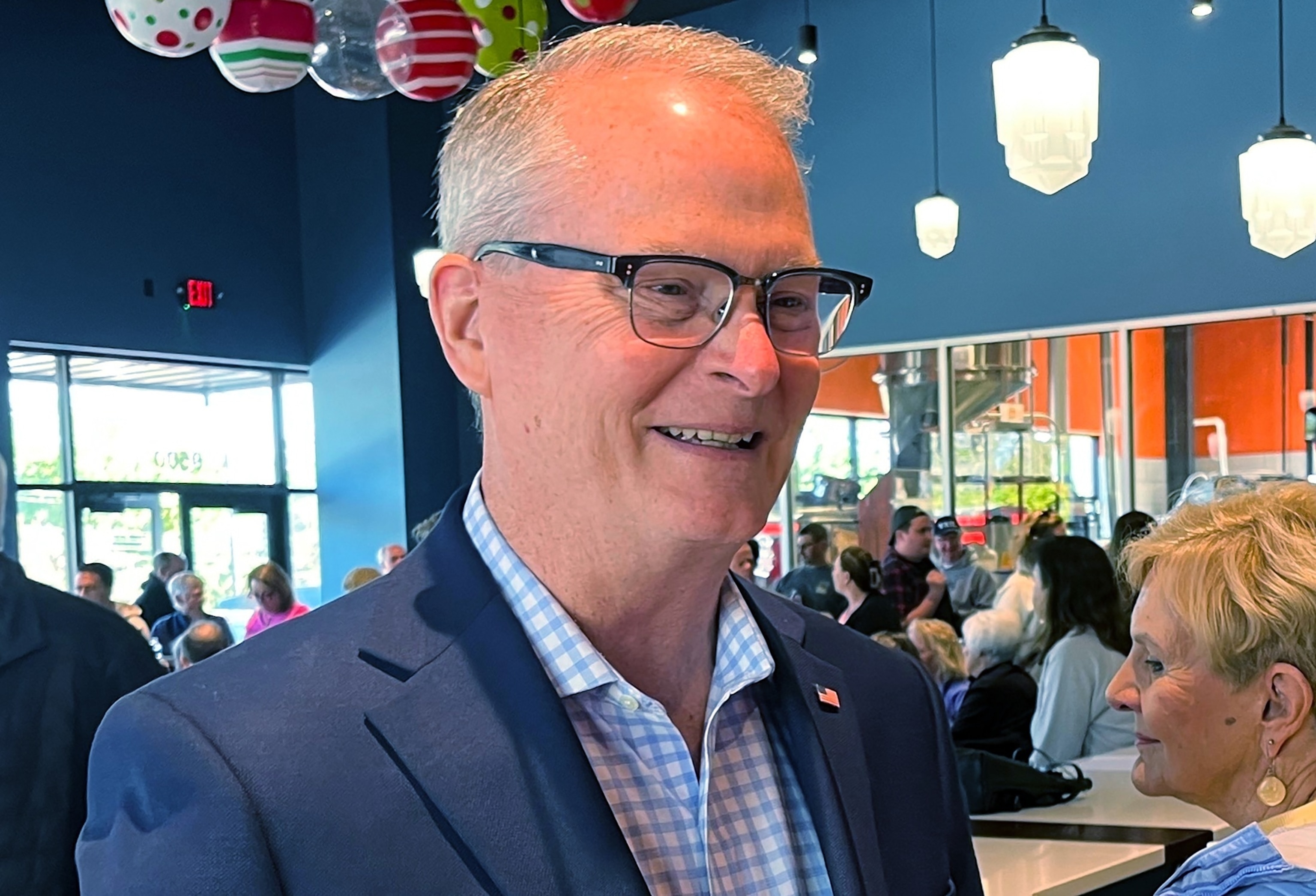 Adam Hamilton, a Methodist mega-church pastor from Kansas, talks to voters as he wraps up a U.S. Senate listening tour, April 18, 2026, at Limitless Brewing in Lenexa, Kansas.Heather Hollingsworth/AP, FILES