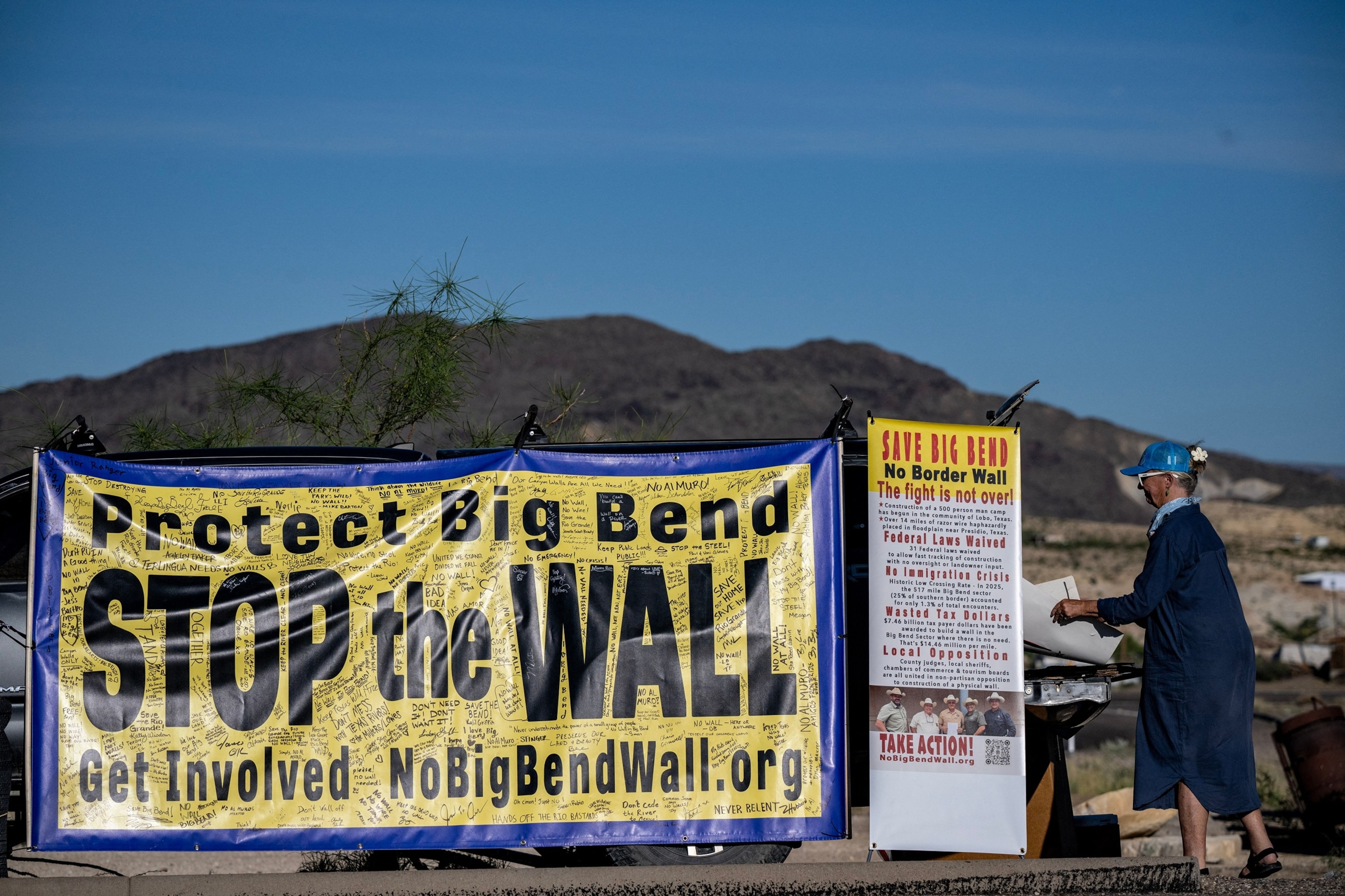 A woman protests the plans by President Donald Trump's administration to build a section of the border wall at the Big Bend National Park in Study Butte, Texas, August 15, 2026.Ronaldo Schemidt/AFP via Getty Images