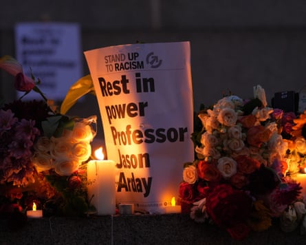 Tributes left after a vigil, organised by the campaign group Stand Up to Racism.Photograph: Yui Mok/PA
