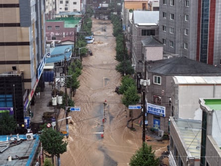 The flooded streets of Geoje following the torrential rain from Saturday to Monday.Photograph: Yonhap news agency/Reuters