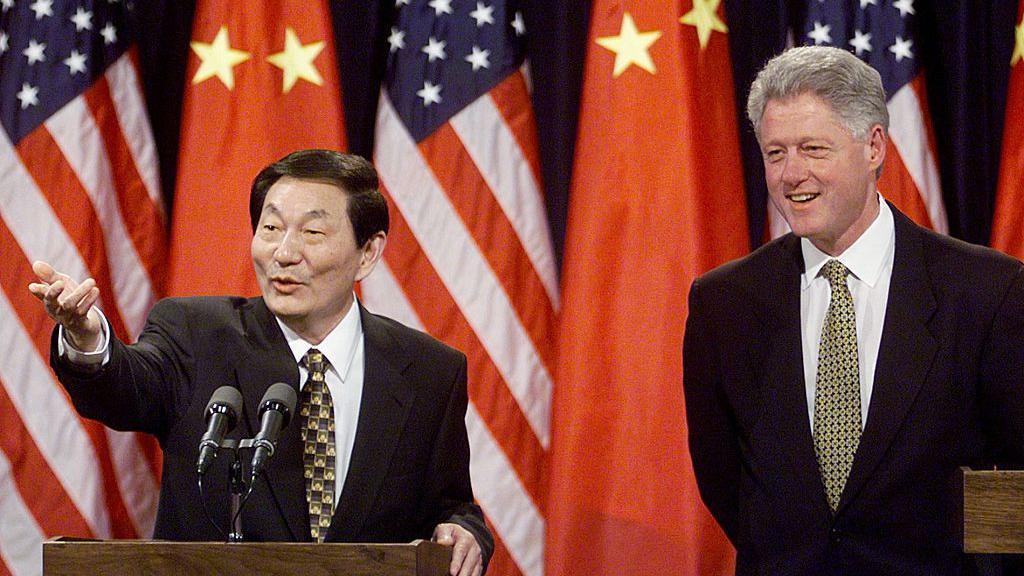 Image caption,Zhu Rongji deadpan humour was on full display at a joint news conference with former US President Bill Clinton in 1999