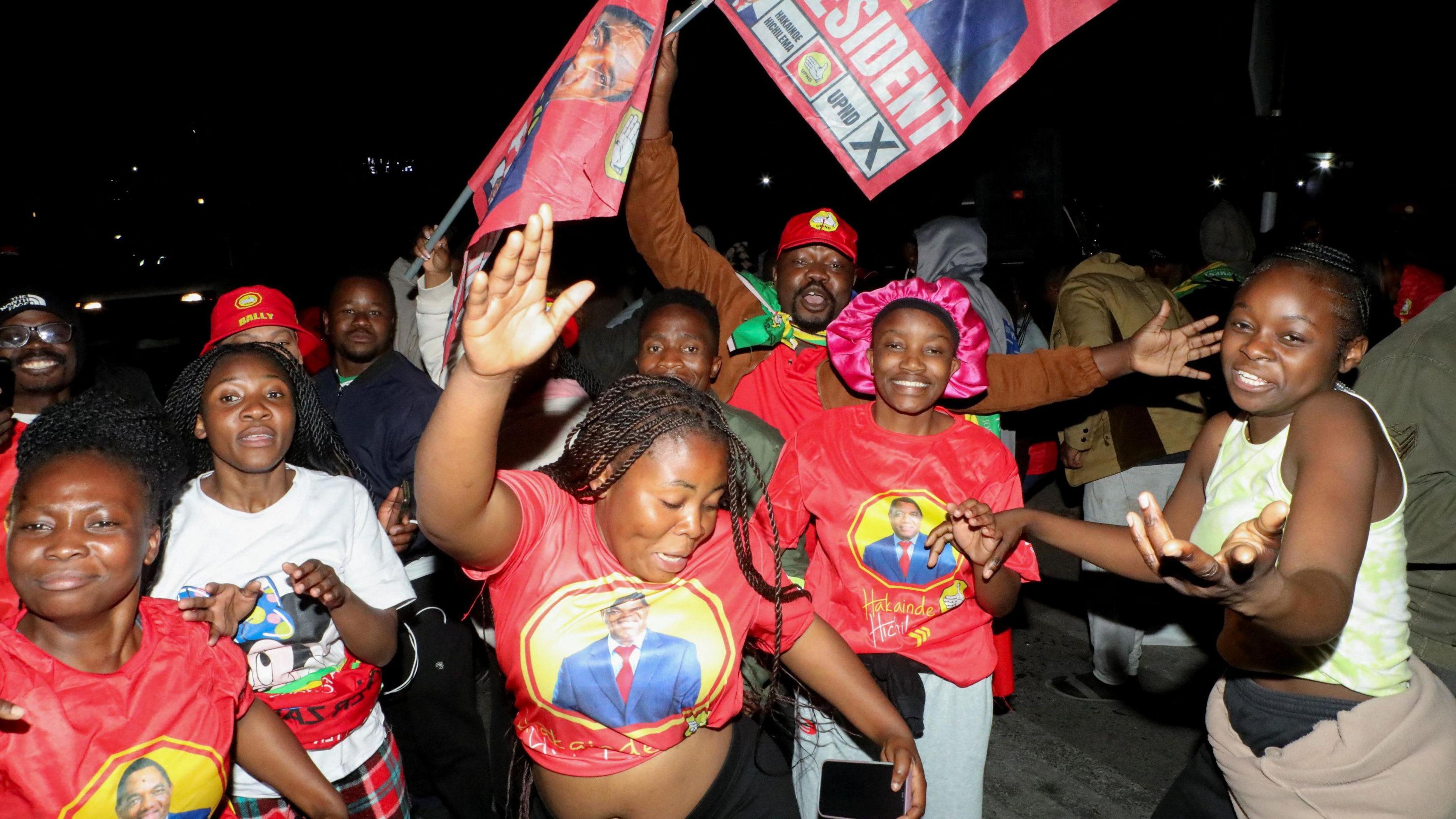 Image caption,Hakainde Hichilema's supporters poured onto the streets to celebrate
