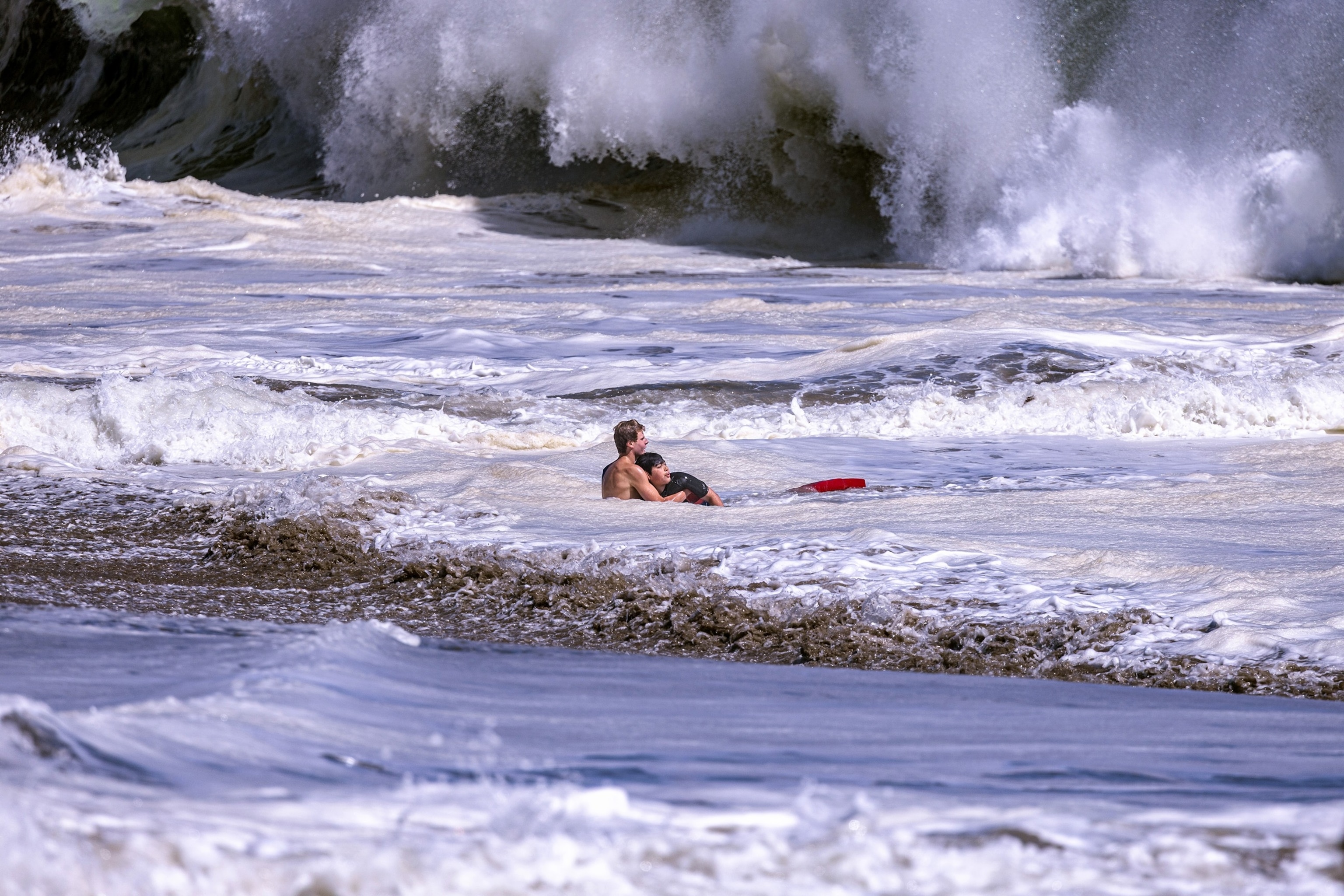 Ryder Williams is pictured rescuing a swimmer at Seabright Beach in Santa Cruz, California, on July 25, 2026.Scott Vander Dussen/@santacruznow