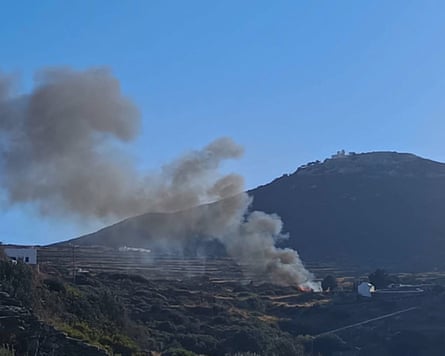 Smoke rises from the site of the crash on Sifnos.Photograph: Reuters