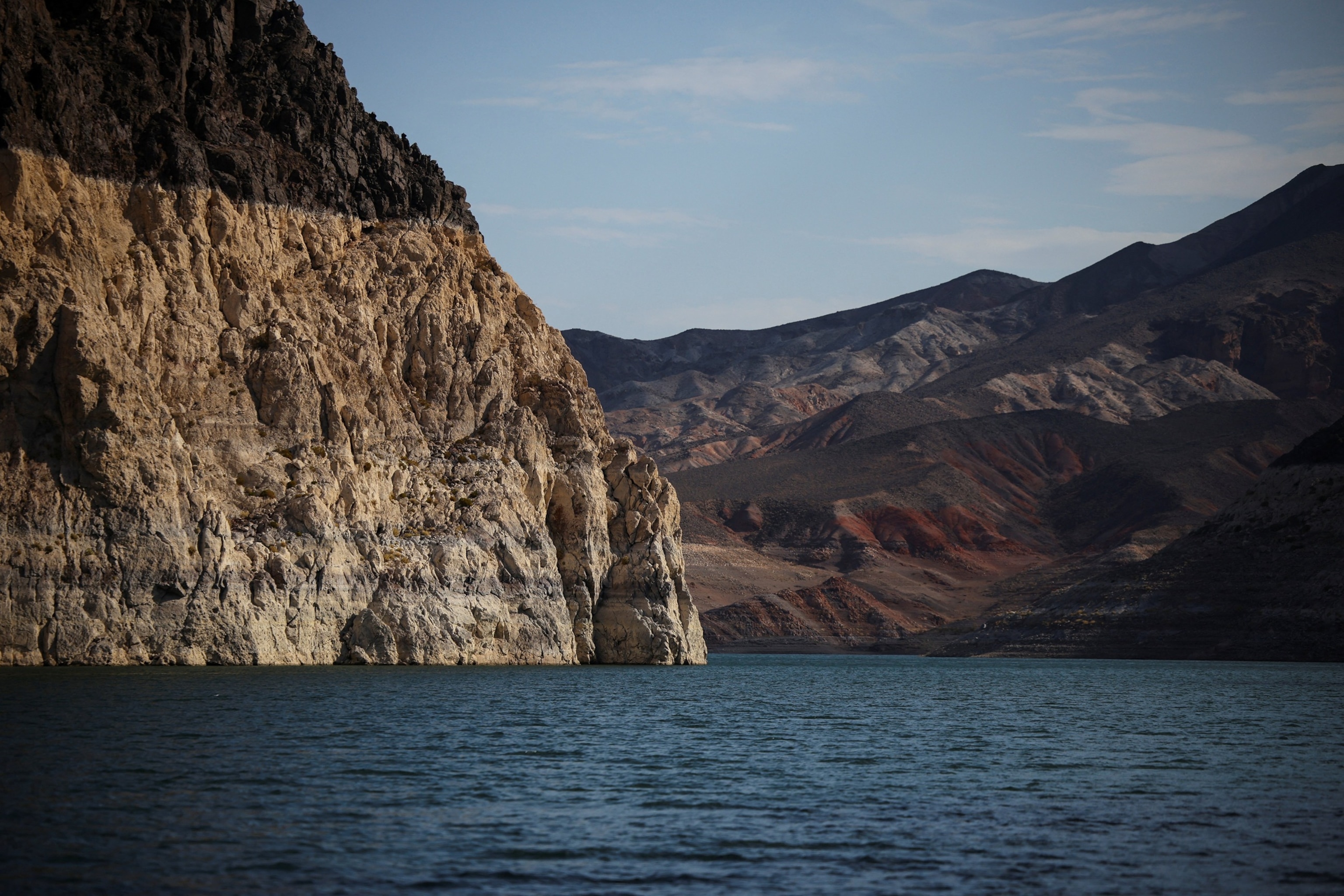 A mineral-stained "bathtub ring" marking previous water levels is visible along the shoreline of Lake Mead, the largest reservoir in the United States by water capacity, highlighting the long-term effects of drought and water demand on the Colorado River system, near Boulder City, Nevada, U.S., August 12, 2026.Daniel Cole/Reuters