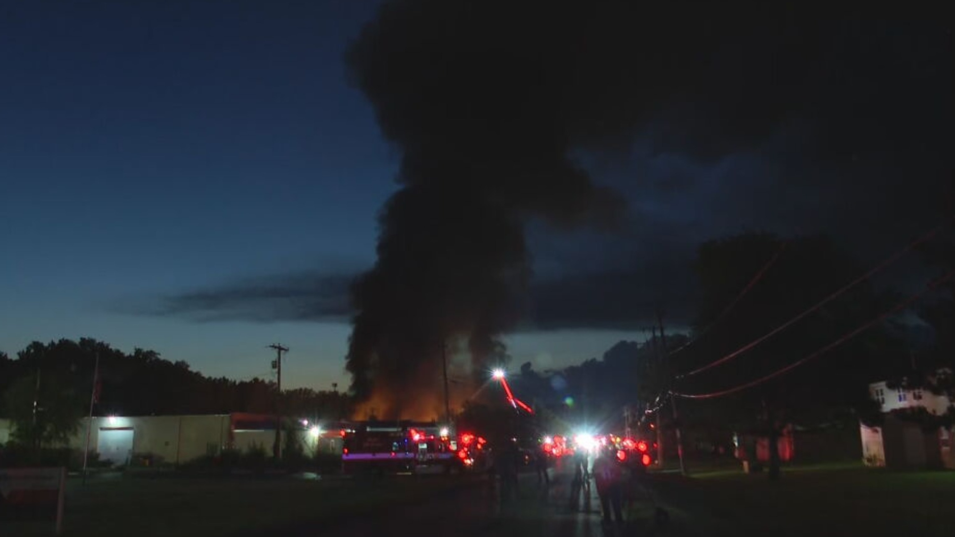 Firefighters battle a blaze following an explosion at an industrial facility in Toledo, Ohio, August 18, 2026.WTVG