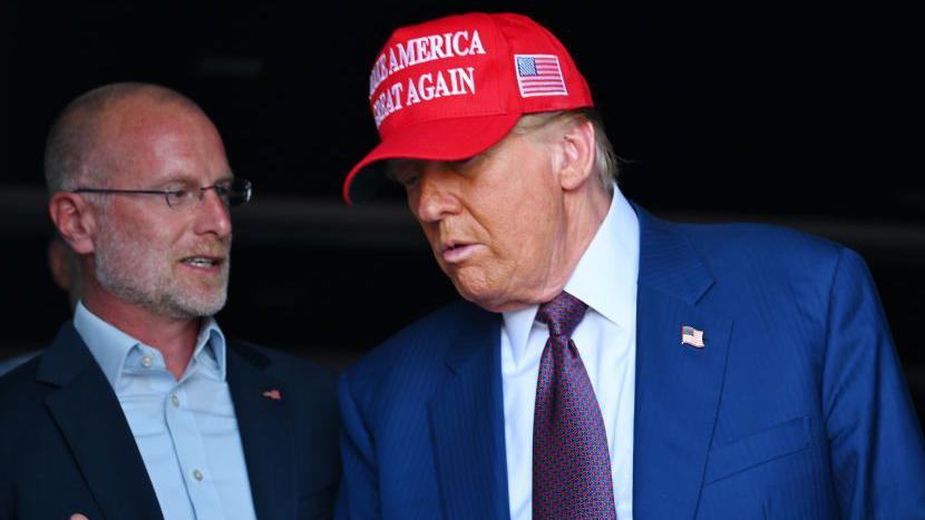 Image caption,Brendan Carr with President Trump (File picture)