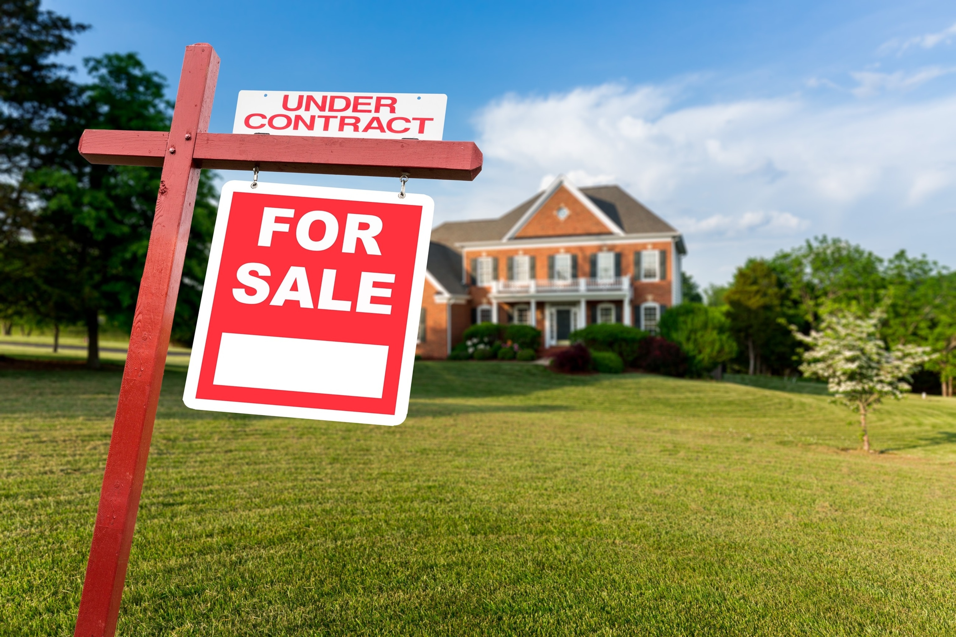Stock photo of a for sale sign in front of a home.Steve Heap/Adobe Stock