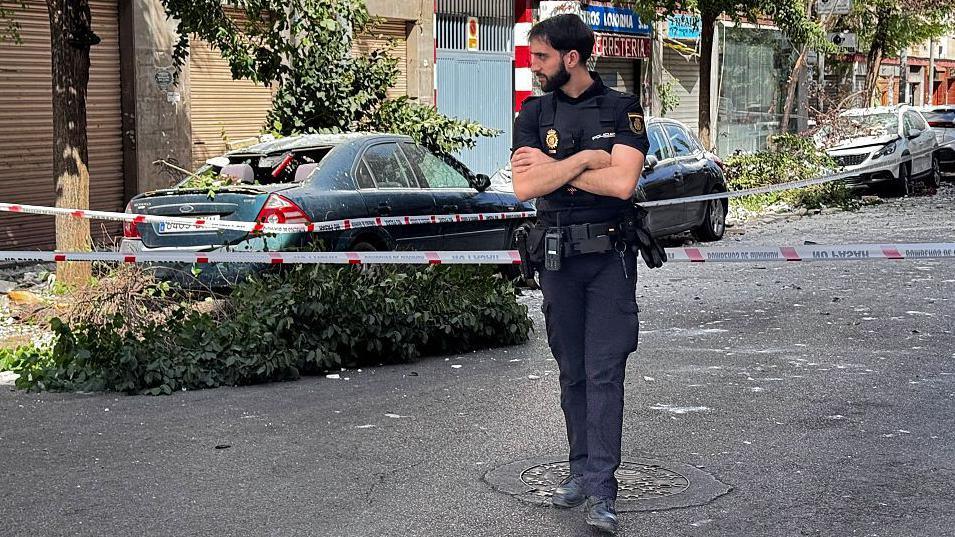 Image caption,A number of vehicles were damaged by falling debris in Tuesday's earthquake