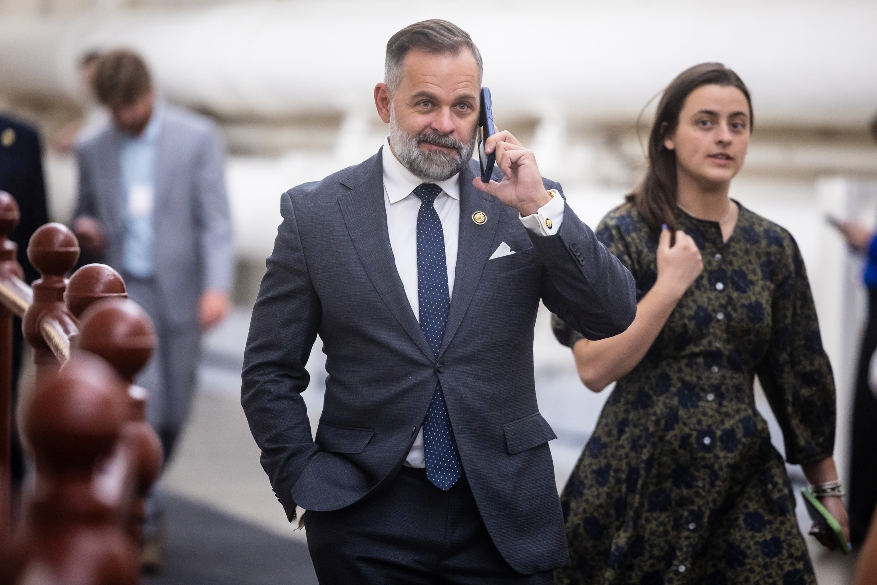 Rep. Cory Mills, R-Fla., holds a phone to his ear as he walks to a vote at the U.S. Capitol on April 15, 2026.Francis Chung/Politico/AP