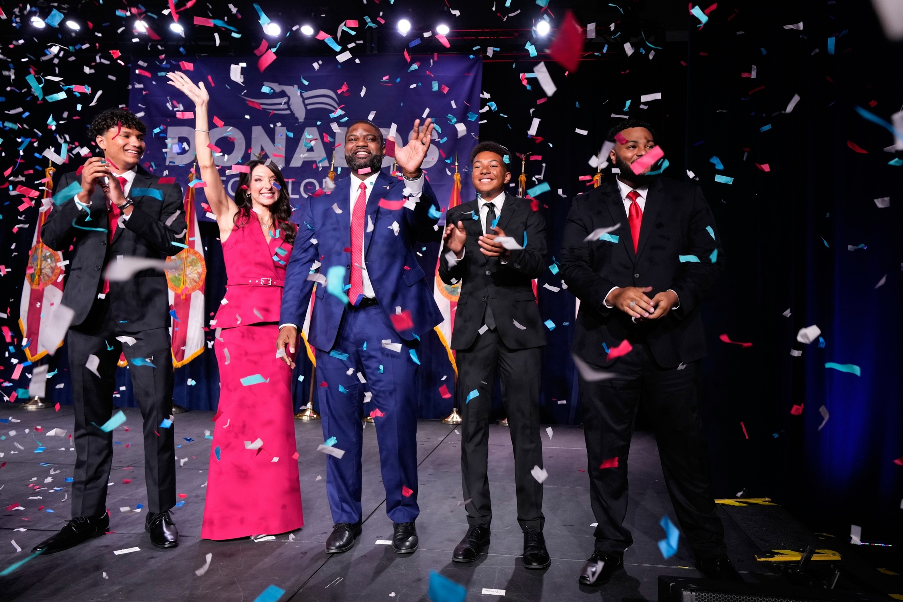Florida Republican gubernatorial candidate Byron Donalds waves next to his wife Erika while standing on stage with their children Darin, left, Damon, second from left, and Mason during a primary election party, Aug. 18, 2026, in Orlando.John Raoux/AP Photo