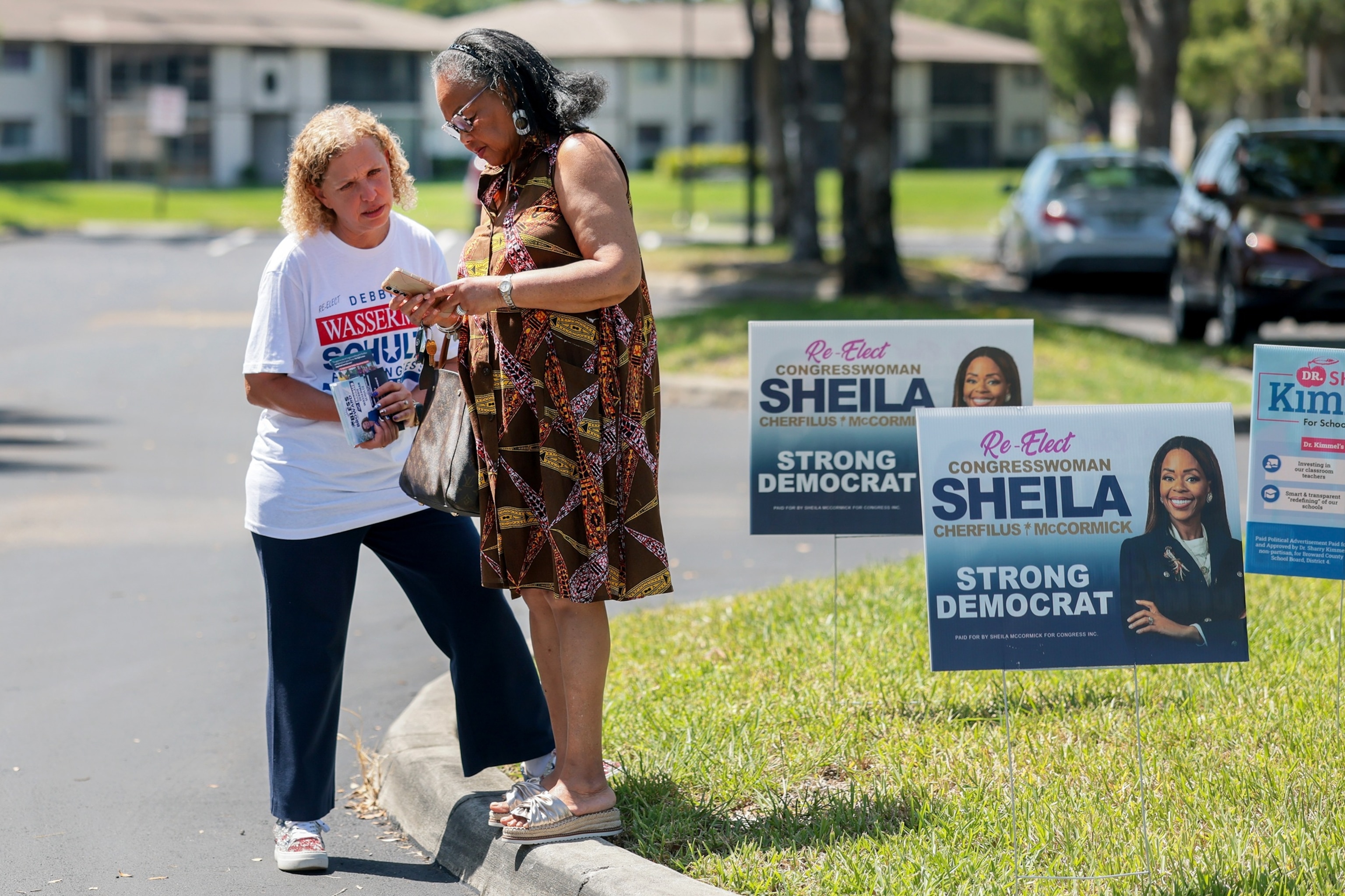 Democratic Congressional candidate Rep. Debbie Wasserman Schultz speaks with voter Camille Edwards as she campaigns outside of the Kings Point Clubhouse polling station, August 18, 2026, in Tamarac, Florida.Joe Raedle/Getty Images