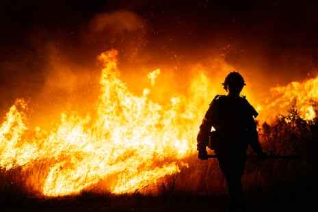 The Hughes fire burns in Castic, California, in January last year.Photograph: Brandon Bell/Getty Images