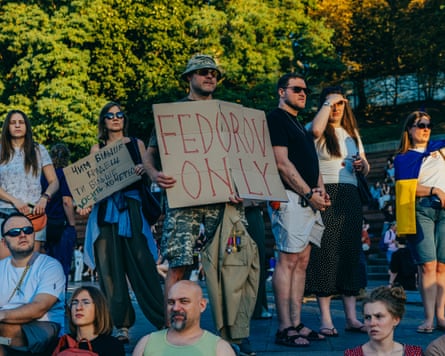 A soldier holds a sign reading ‘Fedorov only’ during a protest in Kyiv on Wednesday.Photograph: Julia Kochetova/The Guardian