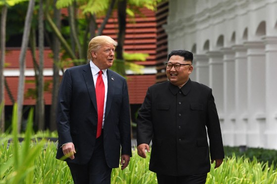 North Korea's leader Kim Jong Un (R) walks with US President Donald Trump (L) during a break in talks at their historic US-North Korea summit, at the Capella Hotel on Sentosa island in Singapore on June 12, 2018.Saul Loeb / AFP via Getty Images