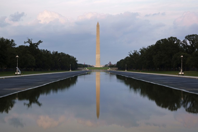 The Washington Monument is reflected in the partially drained reflecting pool on Aug. 12.Kevin Carter / Getty Images