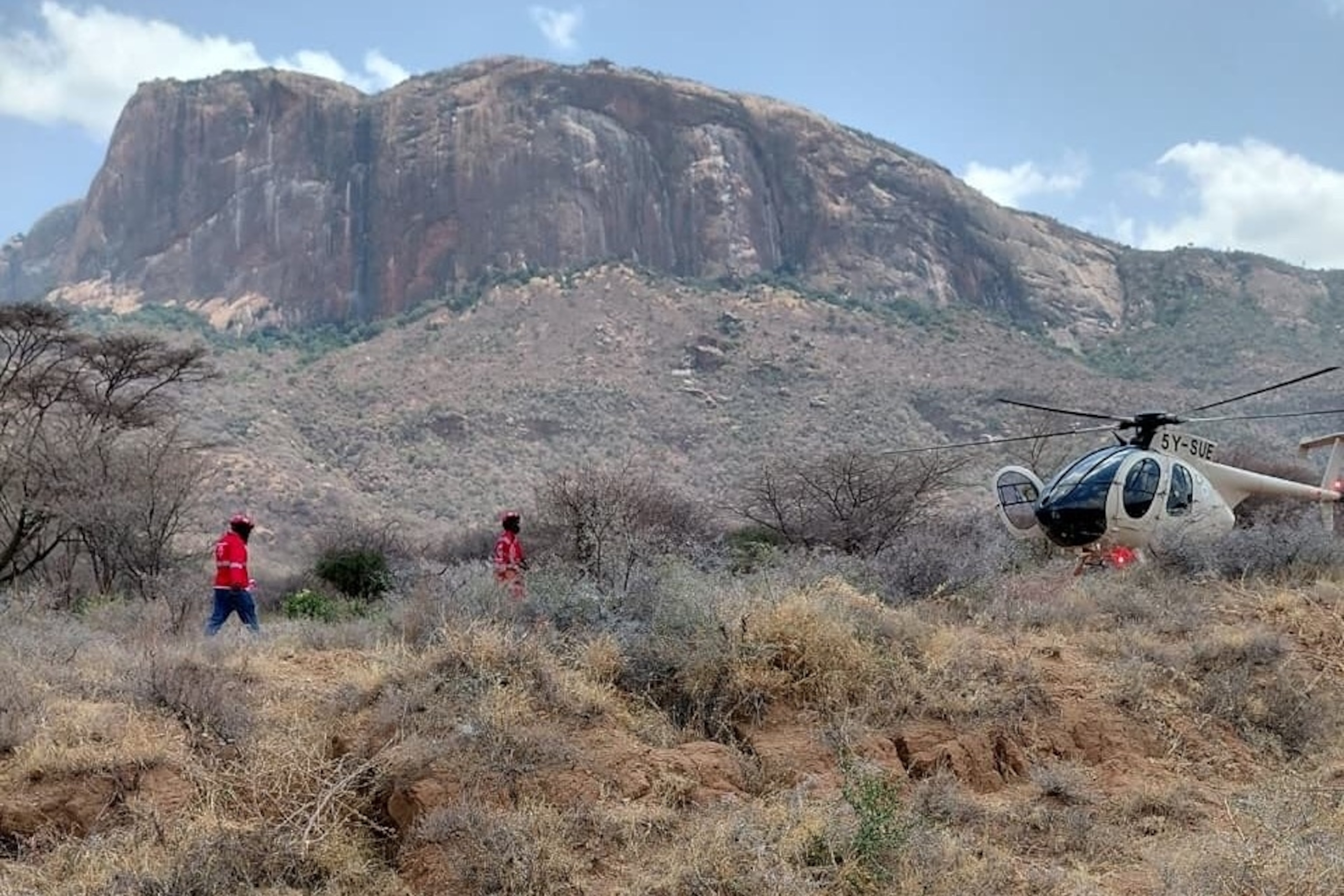 Kenya Red Cross emergency response teams during a multi-agency rescue and recovery operation in response to a helicopter crash that killed tourists near Mt. Ololokwe in Samburu, Kenya, Aug. 19, 2026.Kenya Red Cross via AP