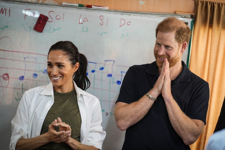 Meghan and Prince Harry, the Duchess and Duke of Sussex, listen to a music class at the QuestScope Youth Center at the Za'atari refugee camp near Mafraq in northern Jordan on Feb. 25.Aaron Chown / PA Images via Getty Images file