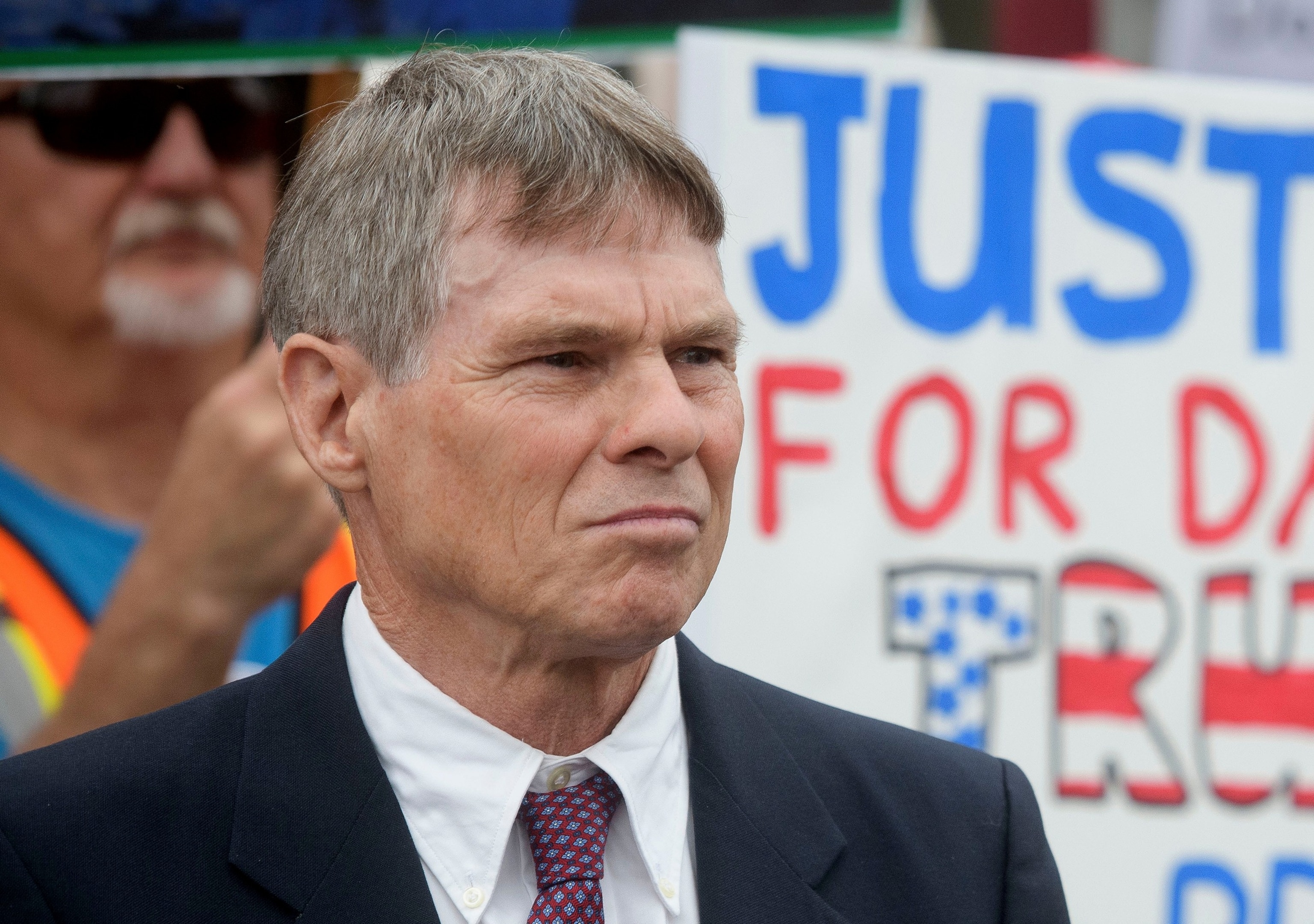 In this July 9, 2026, file photo, former Olympic canoeist David Hearn listens as his attorney Norman Eisen speak after he pleaded not guilty to allegedly damaging the Lincoln Memorial Reflecting Pool, in Washington, D.C.Rod Lamkey/AP Photo, FILE