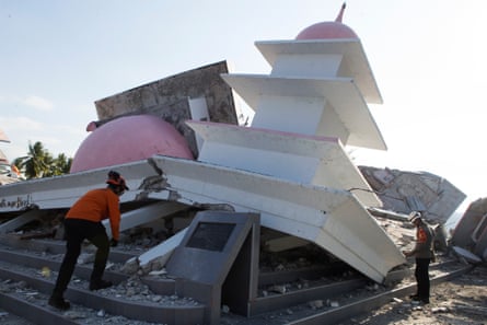 Rescuers inspect the ruins of a mosque that collapsed during an earthquake in North Lamba Leda, East Nusa Tenggara province, Indonesia.Photograph: Firdia Lisnawati/AP