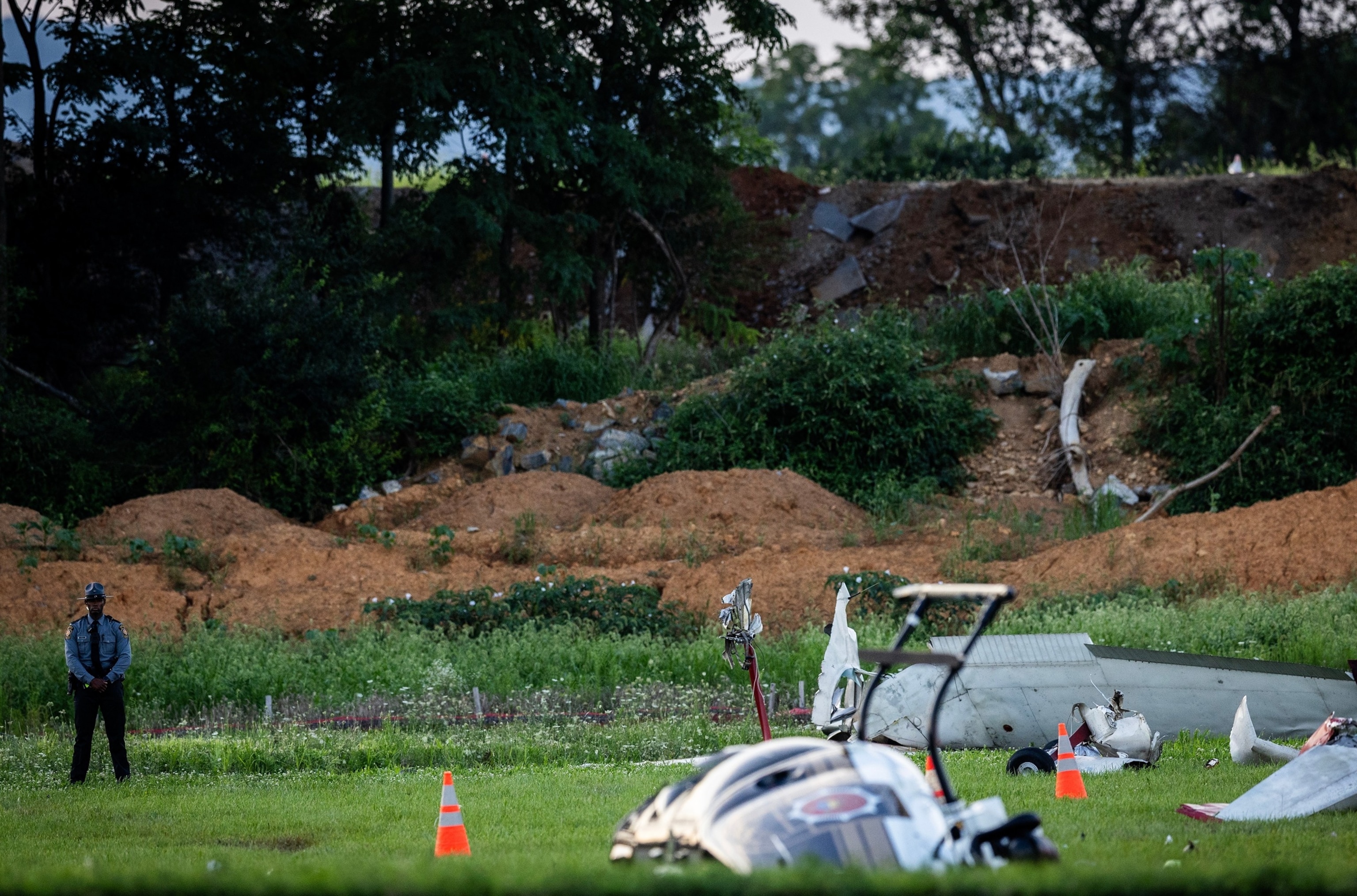 Authorities investigate a crash between a Pennsylvania State Police helicopter and a small plane at the Carlisle airport in Carlisle, Pa. Wednesday, Aug. 19, 2026.Sean Simmers/The Patriot-News via AP