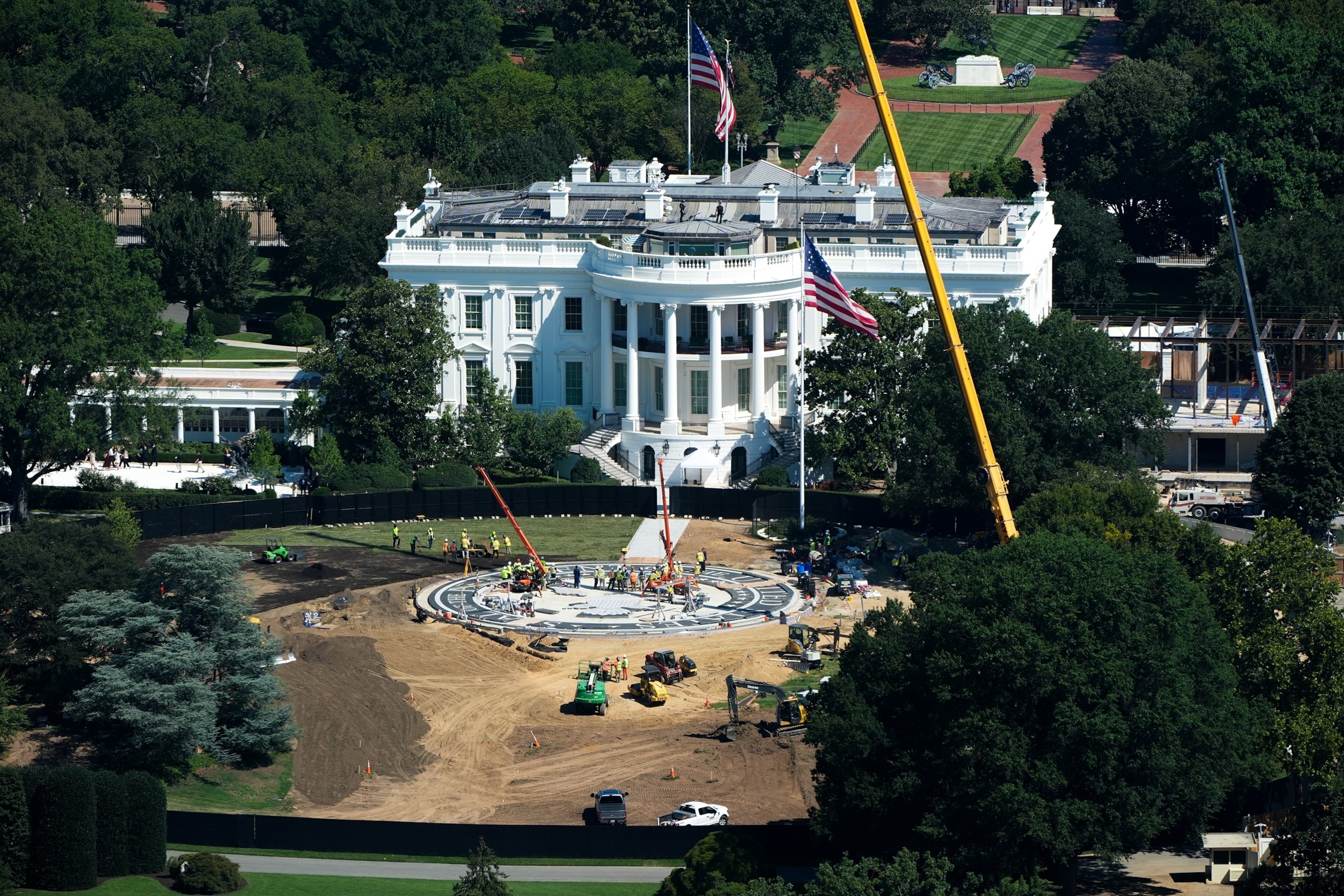 Workers build a helipad on the South Lawn of the White House and continue construction on the new White House ballroom as seen from the Washington Monument, Aug. 19, 2026, in Washington.Alex Brandon/AP Photo